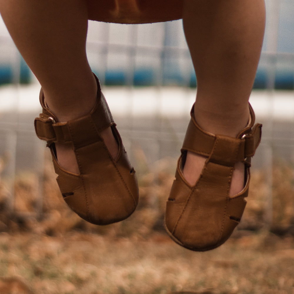 Rose Chestnut Dakota toddler first walker shoes in tan leather, featuring soft soles and adjustable straps for early mobility.