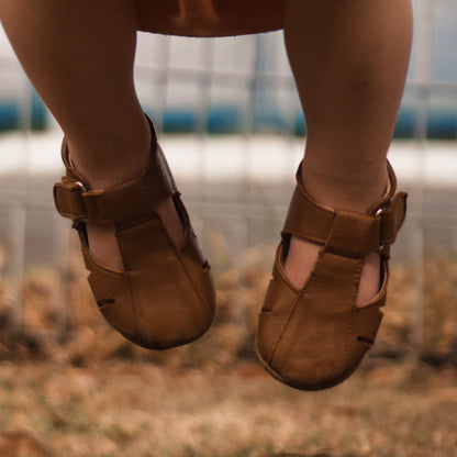 Rose Chestnut Dakota toddler first walker shoes in tan leather, featuring soft soles and adjustable straps for early mobility.