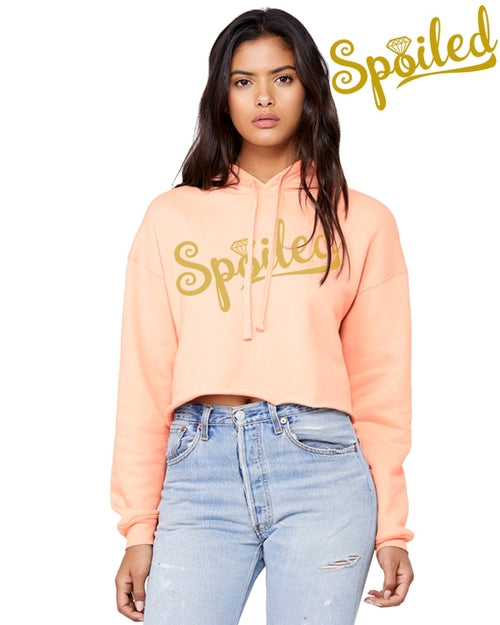 Peach-colored Spoiled Crop Top Hoodie by Gold Charlie, casual sweater with cropped fit and playful graphic design.