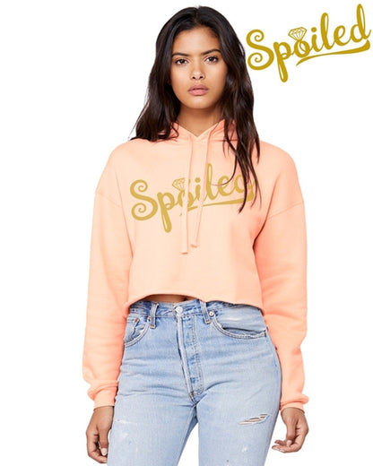 Peach-colored Spoiled Crop Top Hoodie by Gold Charlie, casual sweater with cropped fit and playful graphic design.