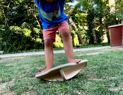 Red Oceanus Maze Wooden Balance Board, a furniture piece with a smooth wooden surface and curved design for stability and balance.
