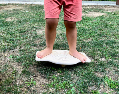 Red Oceanus Maze Wooden Balance Board, a natural wooden furniture piece with a curved, maze-like design for balance and decor.