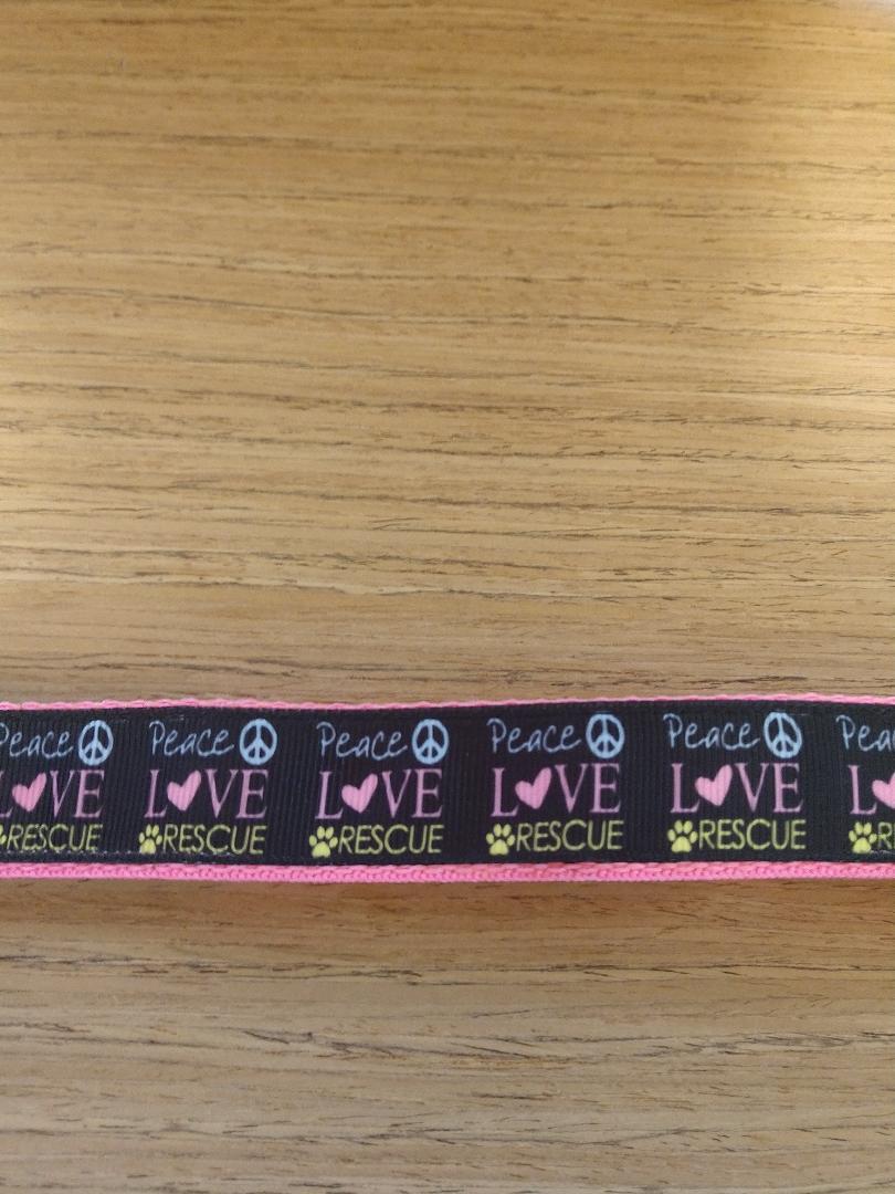 Large pink collar from Green Thalassa featuring Peace Love and Rescue design, suitable for pets.