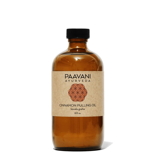 Ayurvedic Cinnamon Pulling Oil by Sky Blue Pontus in a glass bottle, used for oral health and oil pulling therapy.