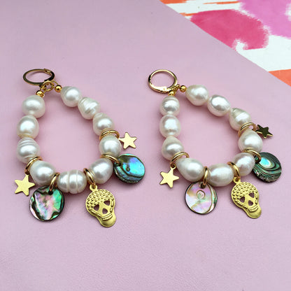 Pink pearl charm earrings by Yellow Athena with delicate pearl accents and silver hooks, stylish and elegant for everyday wear.
