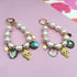 Pink pearl charm earrings by Yellow Athena with delicate pearl accents and silver hooks, stylish and elegant for everyday wear.