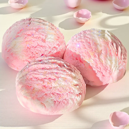 Organic Coco Butter and Coconut Milk foaming bath truffle by Emerald Tulsi, shown in a relaxing bath setting.