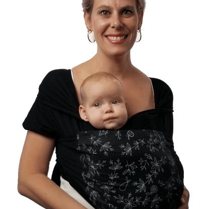 Amber Leto Snüg baby clothing with a colorful, folded design on soft fabric, perfect for infants.