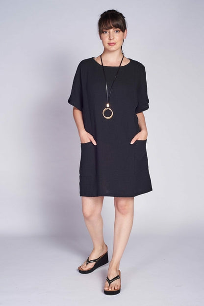 Black cotton pocket shift dress for women by Purple Mango, featuring a simple, comfortable design with side pockets.