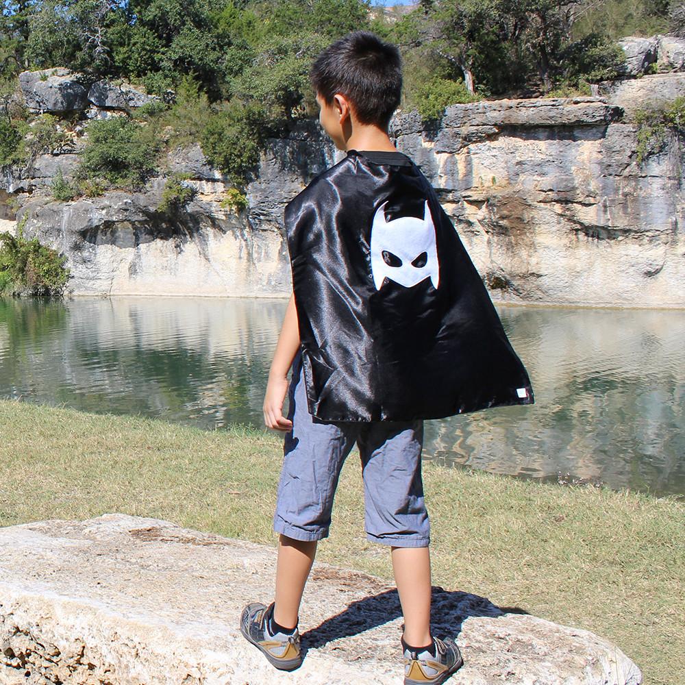 Black superhero cape for kids by Sky Blue Milo, featuring a vibrant "Pow" design, perfect for imaginative play and dress-up.
