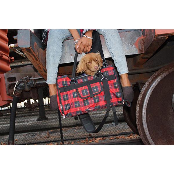 Pink Coconut 312 Hideaway™ Duffel pet carrier with red plaid fabric, featuring mesh windows and carrying handles for dogs or puppies.