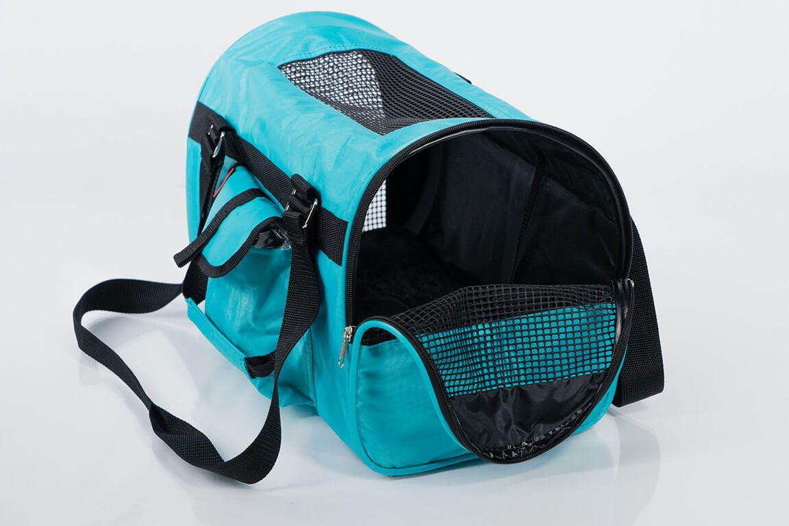 Pink Coconut 566 Jet Carrier pet carrier in aqua, half-side open view showing breathable mesh sides and sturdy handle.