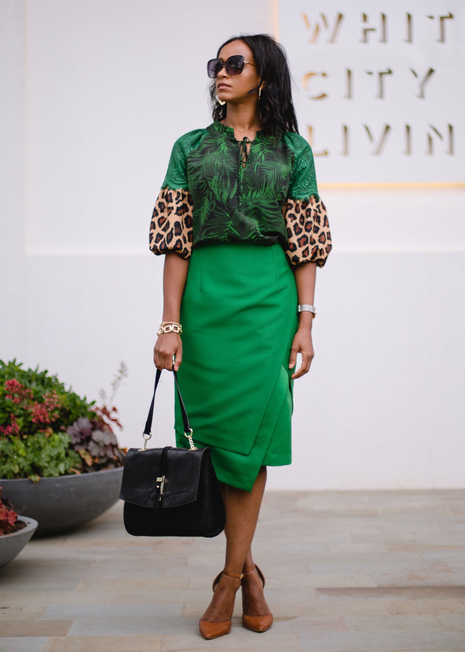 Women’s tropical statement skirt by Erin Ophion featuring vibrant, colorful floral and leaf patterns, perfect for warm-weather wear.