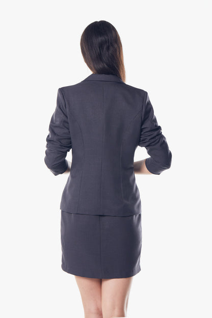Women’s Luxe Charcoal Blazer by Mauve Daisy, tailored office jacket with a sleek fit, worn over a white blouse.