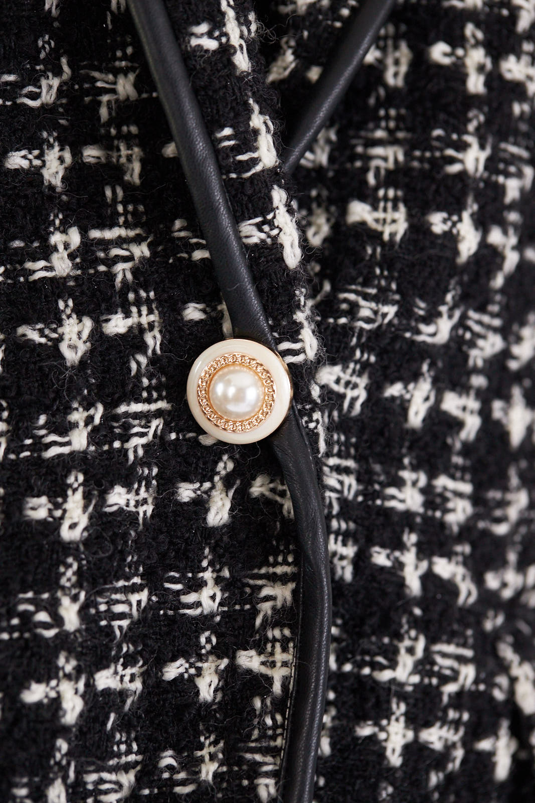 Women’s black and white tweed checkers blazer by Mauve Daisy, tailored chic jacket with classic checkered pattern.