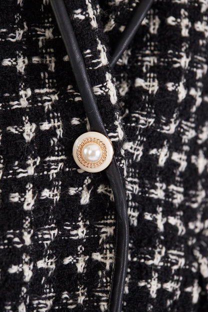 Women’s black and white tweed checkers blazer by Mauve Daisy, tailored chic jacket with classic checkered pattern.