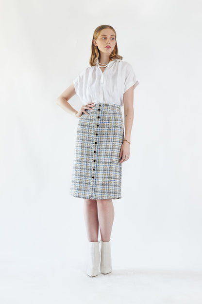 Women’s Luxe Plaid Tweed Pencil Skirt by Mauve Daisy, featuring a chic tailored design in stylish plaid and tweed fabric.