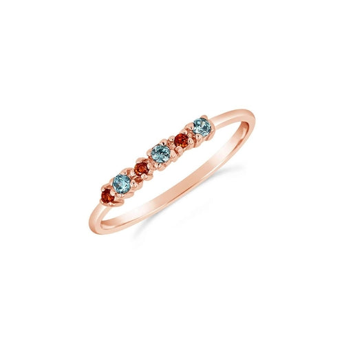 Blue Theia Carnival ring in rose gold with intricate jewelry design, showcasing elegant craftsmanship.