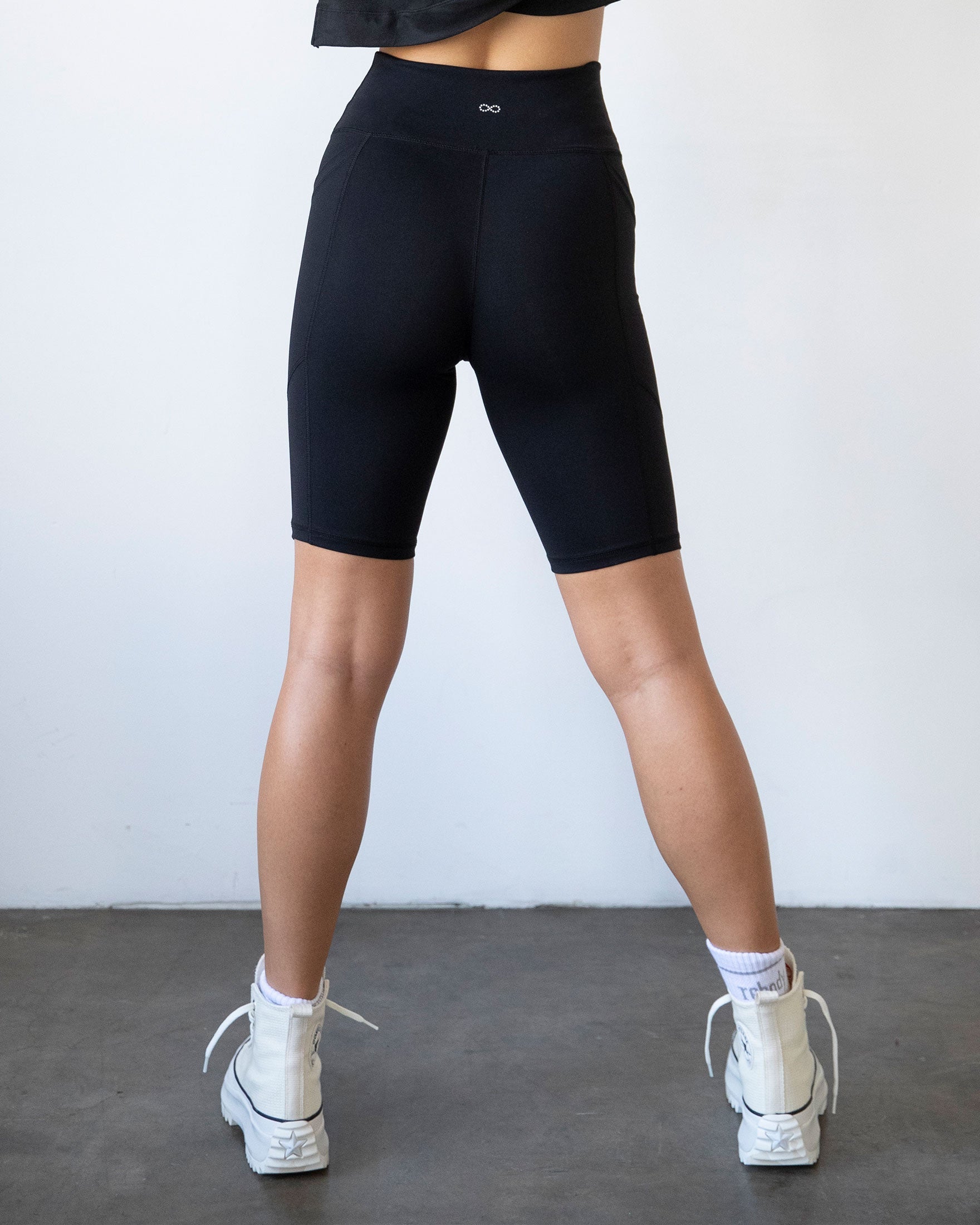 Black Lemon Molly Making Moves pocket biker shorts with 8.5-inch inseam, shown from the back on a model.