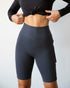 Lemon Molly Making Moves pocket biker shorts for women, 8.5-inch length, in smoke color, front view showing pocket details.