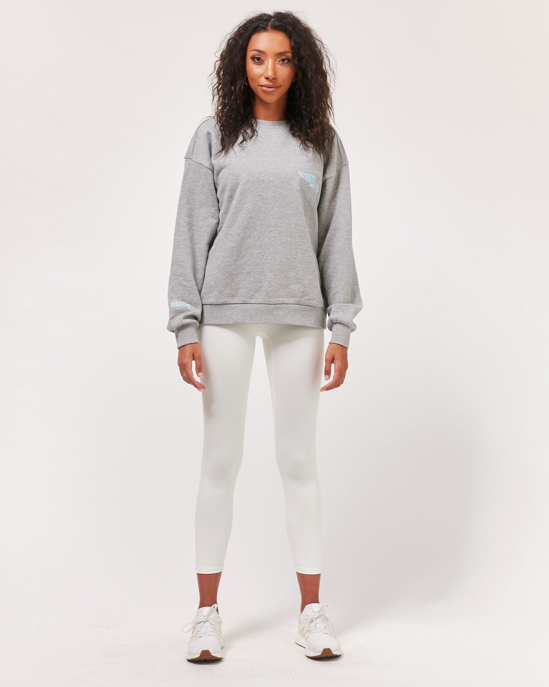 Gray elegant blouse by Start2Finish with matching accessories, shown on a hanger for stylish apparel display.