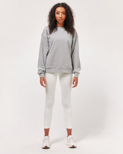 Gray elegant blouse by Start2Finish with matching accessories, shown on a hanger for stylish apparel display.