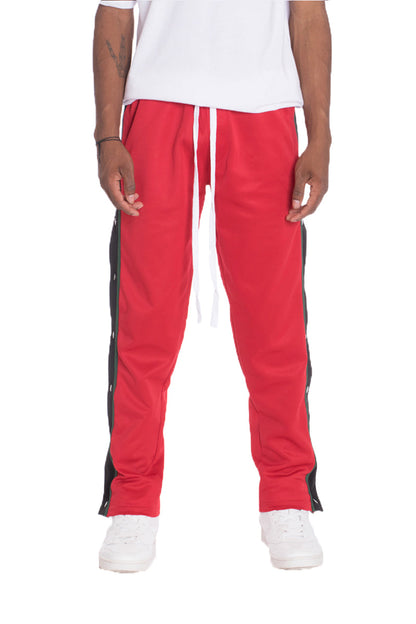 Red Lime Milo Snap Button Track Pants with elastic waistband and side pockets, ideal for casual wear.