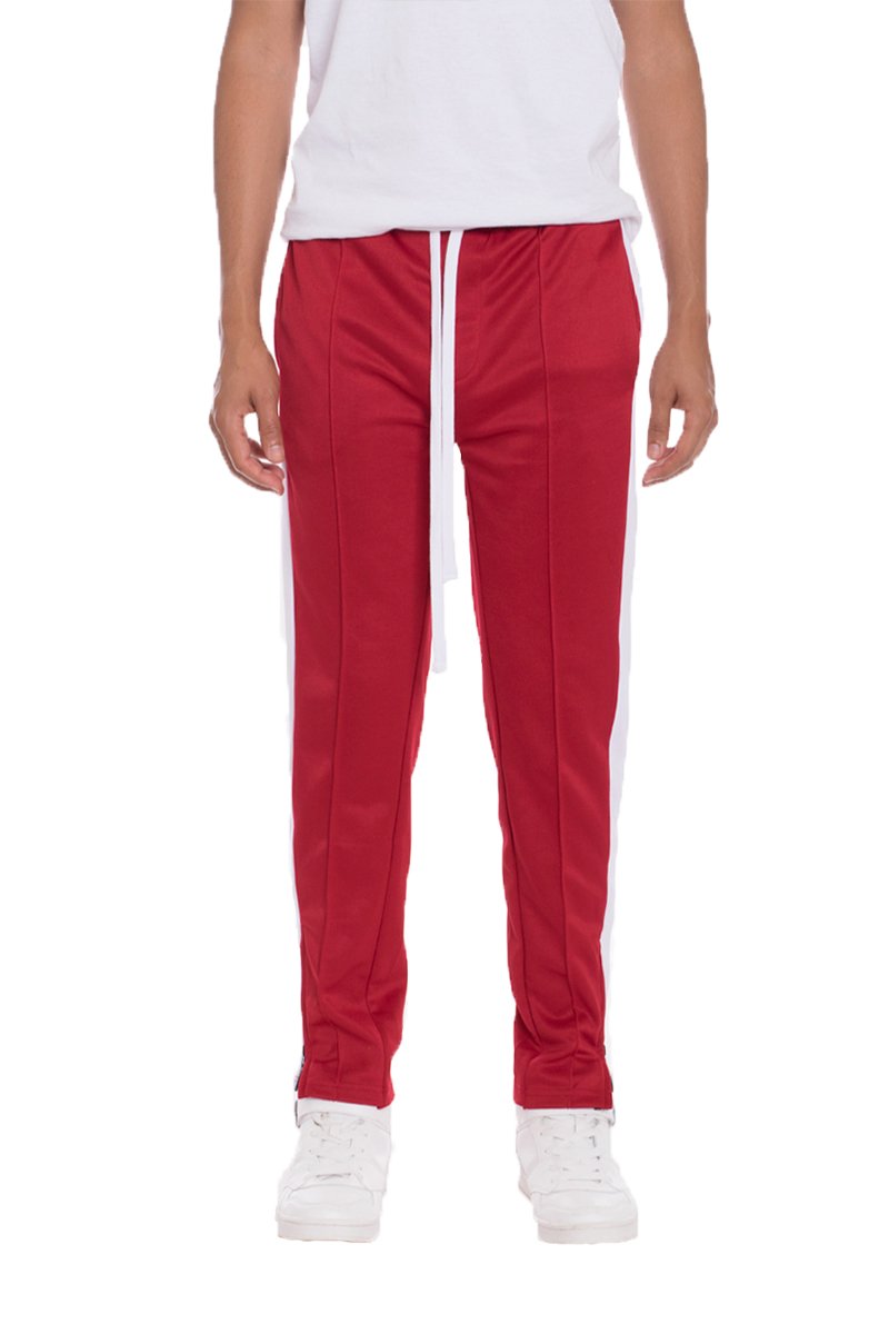 Lime Milo red tricot sweat pants with a relaxed fit, featuring elastic waistband and cuffs, made from soft knit fabric.