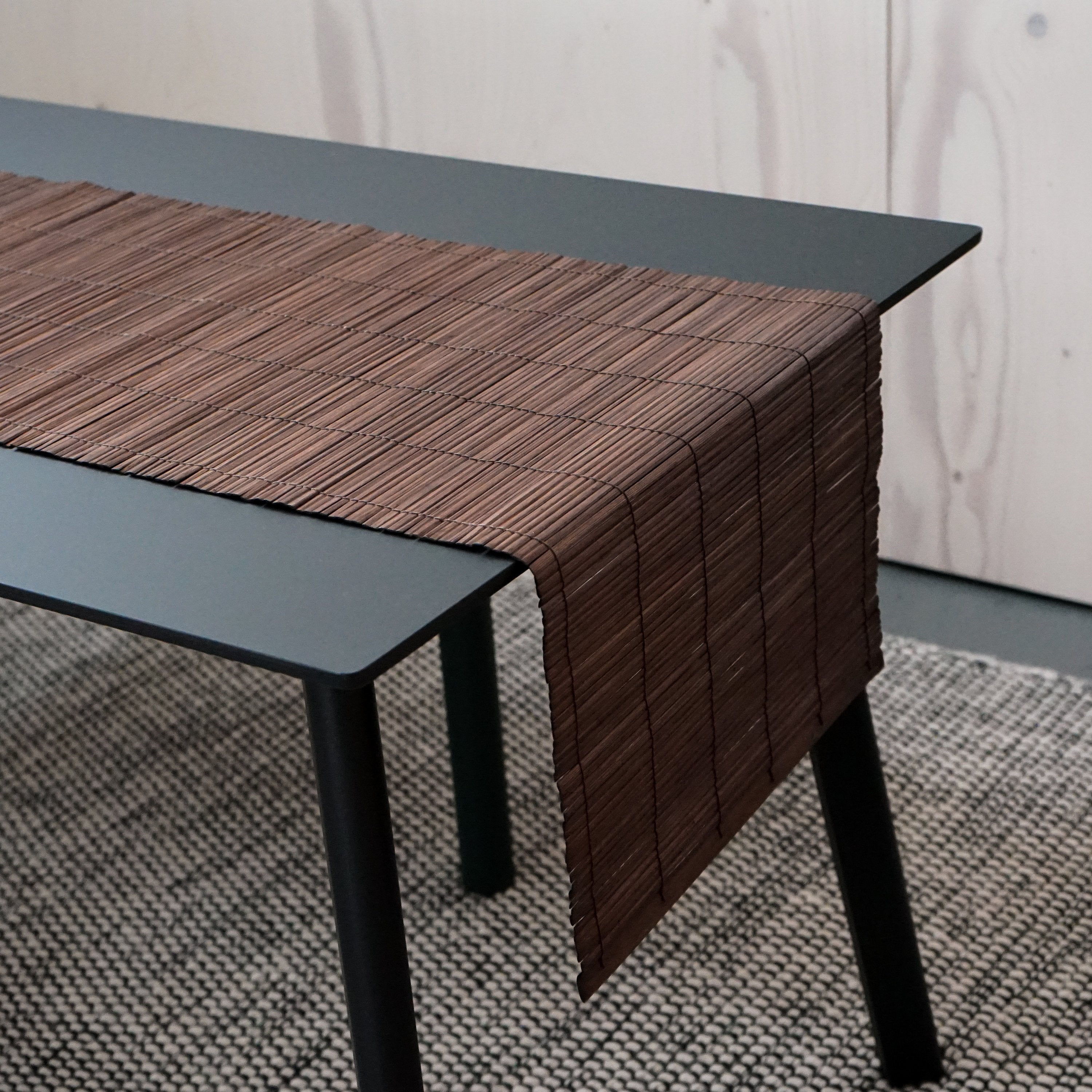 Bamboo table runner by Orchid Daisy, natural-colored fabric with a smooth texture, spread on a wooden dining table for home decor.