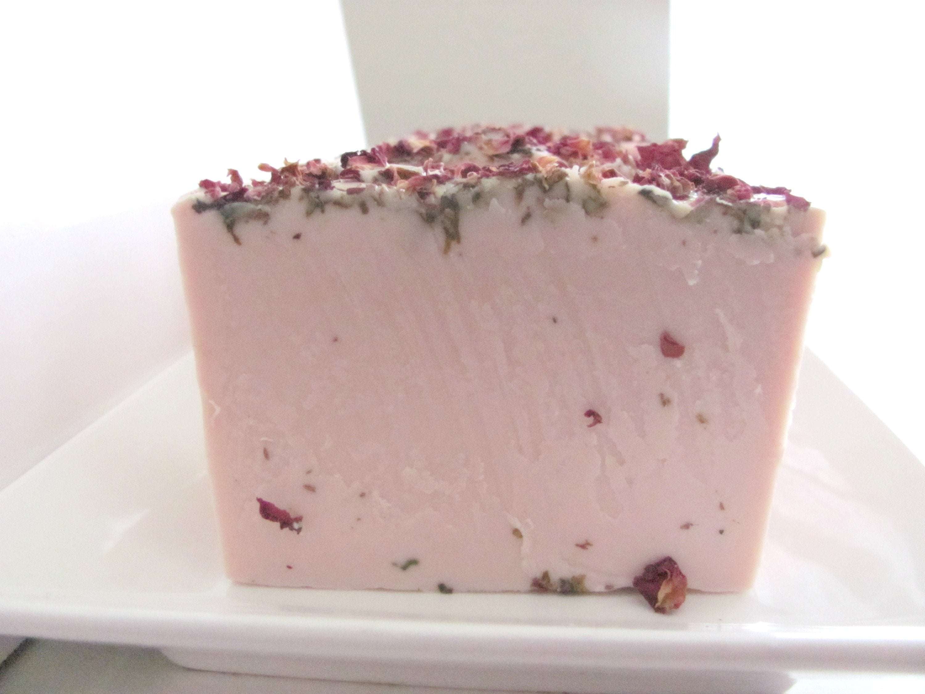 Magenta Hades Whole Lotta Rosie soap bar for bath and beauty, featuring a smooth, fragrant soap with floral rose scent.