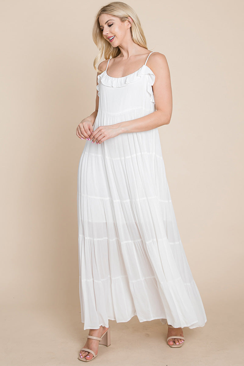 Cream tiered tie strap maxi dress for women by Aquamarine Gaia, featuring a flowing silhouette and adjustable straps.