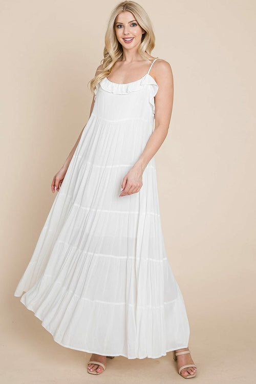 Cream tiered tie strap cami maxi dress for women by Aquamarine Gaia, featuring layered fabric and adjustable shoulder straps.