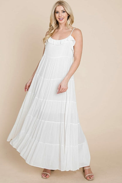 Cream tiered tie strap cami maxi dress for women by Aquamarine Gaia, featuring layered fabric and adjustable shoulder straps.
