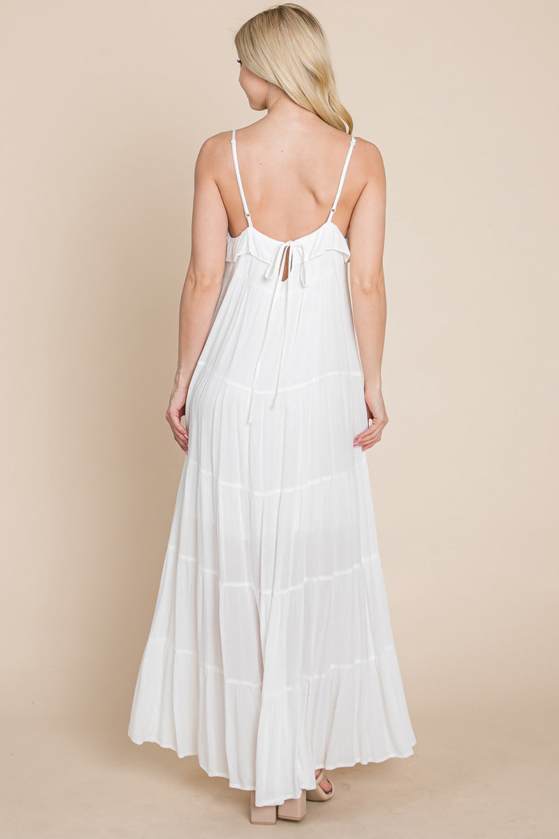 Cream tiered tie strap cami maxi dress for women by Aquamarine Gaia, featuring a flowing silhouette and adjustable straps.