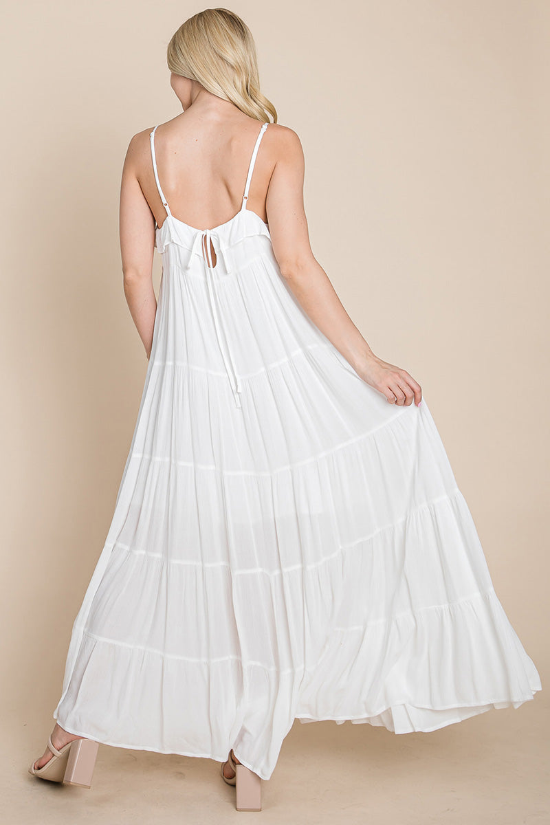 Cream tiered tie strap cami maxi dress for women by Aquamarine Gaia, featuring layered fabric and adjustable shoulder straps.
