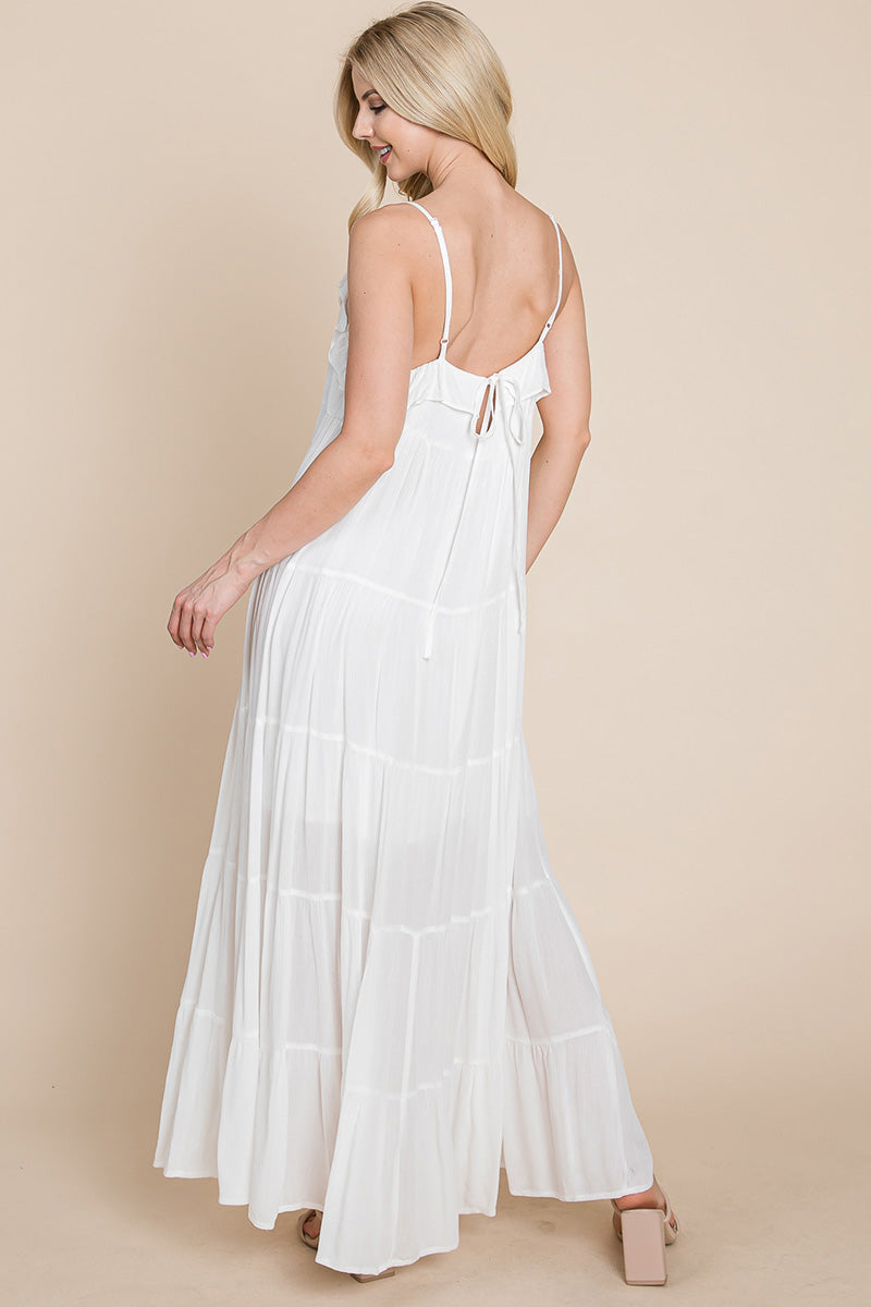 Cream tiered tie strap cami maxi dress for women by Aquamarine Gaia, featuring layered fabric and adjustable straps.