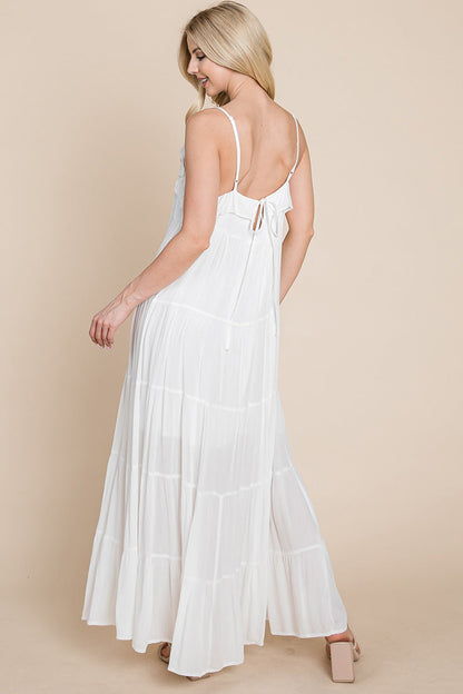 Cream tiered tie strap cami maxi dress for women by Aquamarine Gaia, featuring layered fabric and adjustable straps.