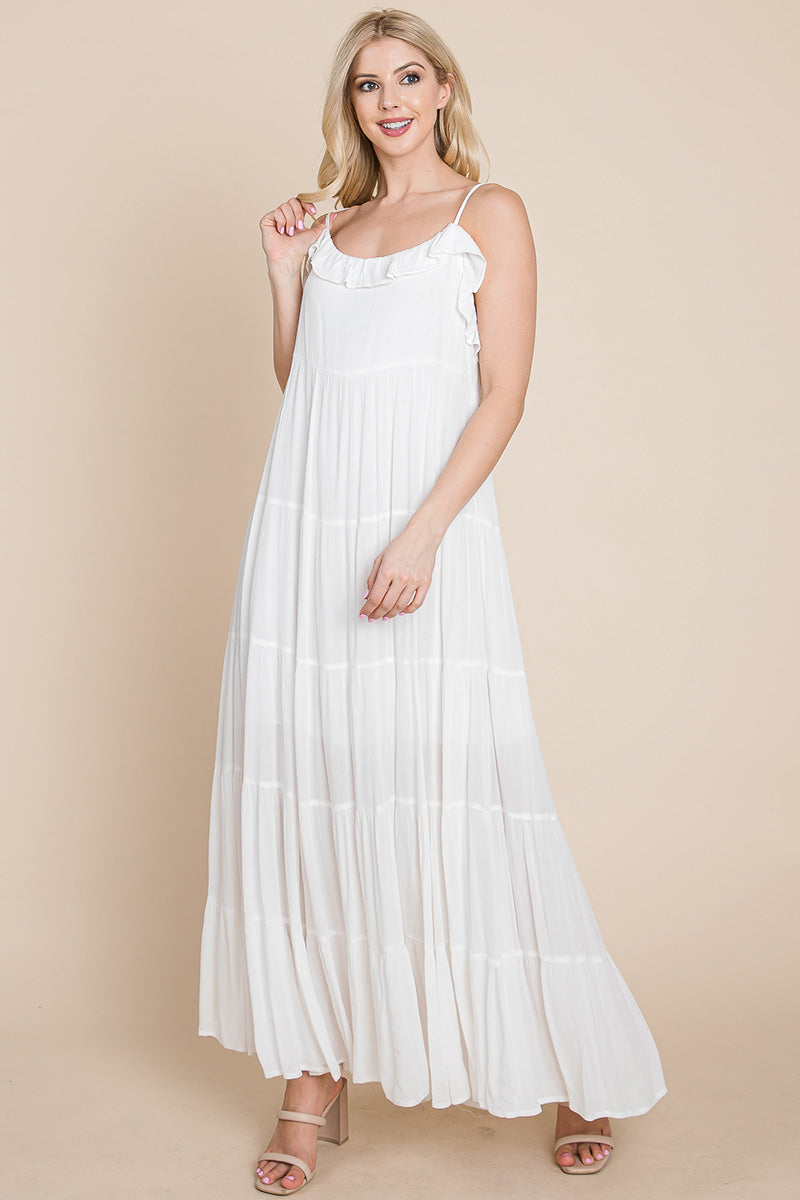 Cream tiered tie strap cami maxi dress for women by Aquamarine Gaia, featuring a flowing silhouette and adjustable straps.