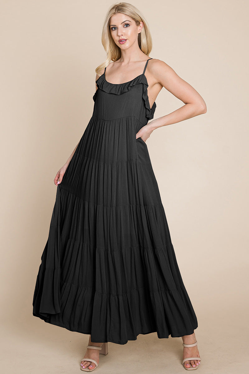 Black tiered tie strap cami maxi dress for women by Aquamarine Gaia, featuring layered fabric and adjustable straps.