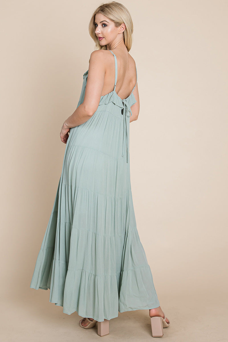 Sage green tiered tie strap cami maxi dress for women by Aquamarine Gaia, featuring a flowy silhouette and adjustable straps.
