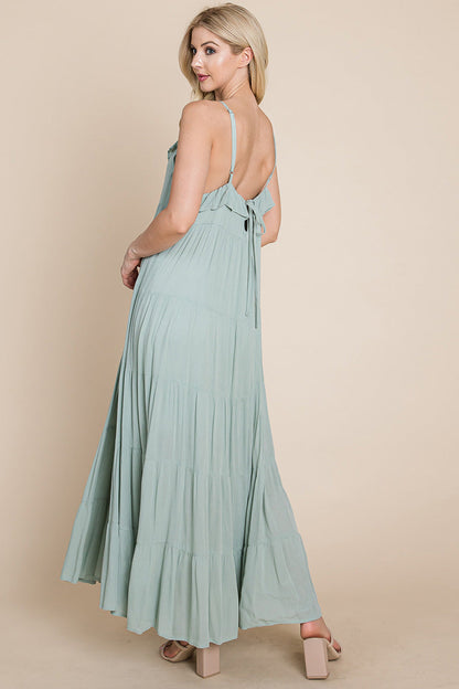 Sage green tiered tie strap cami maxi dress for women by Aquamarine Gaia, featuring a flowy silhouette and adjustable straps.
