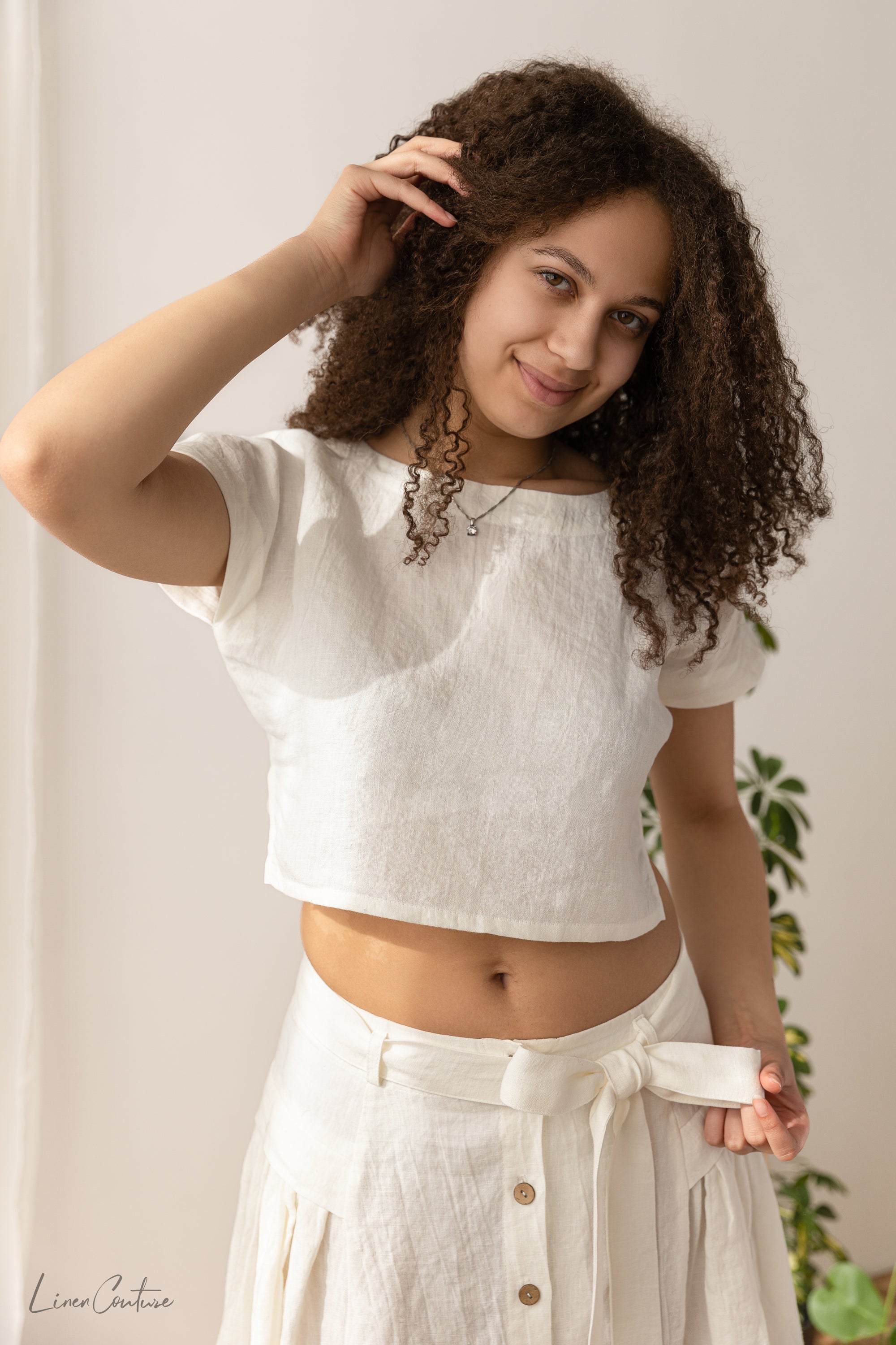 Magenta Sugarplum Taormina linen crop top and flared midi skirt matching set in natural fabric, styled together on a model.
