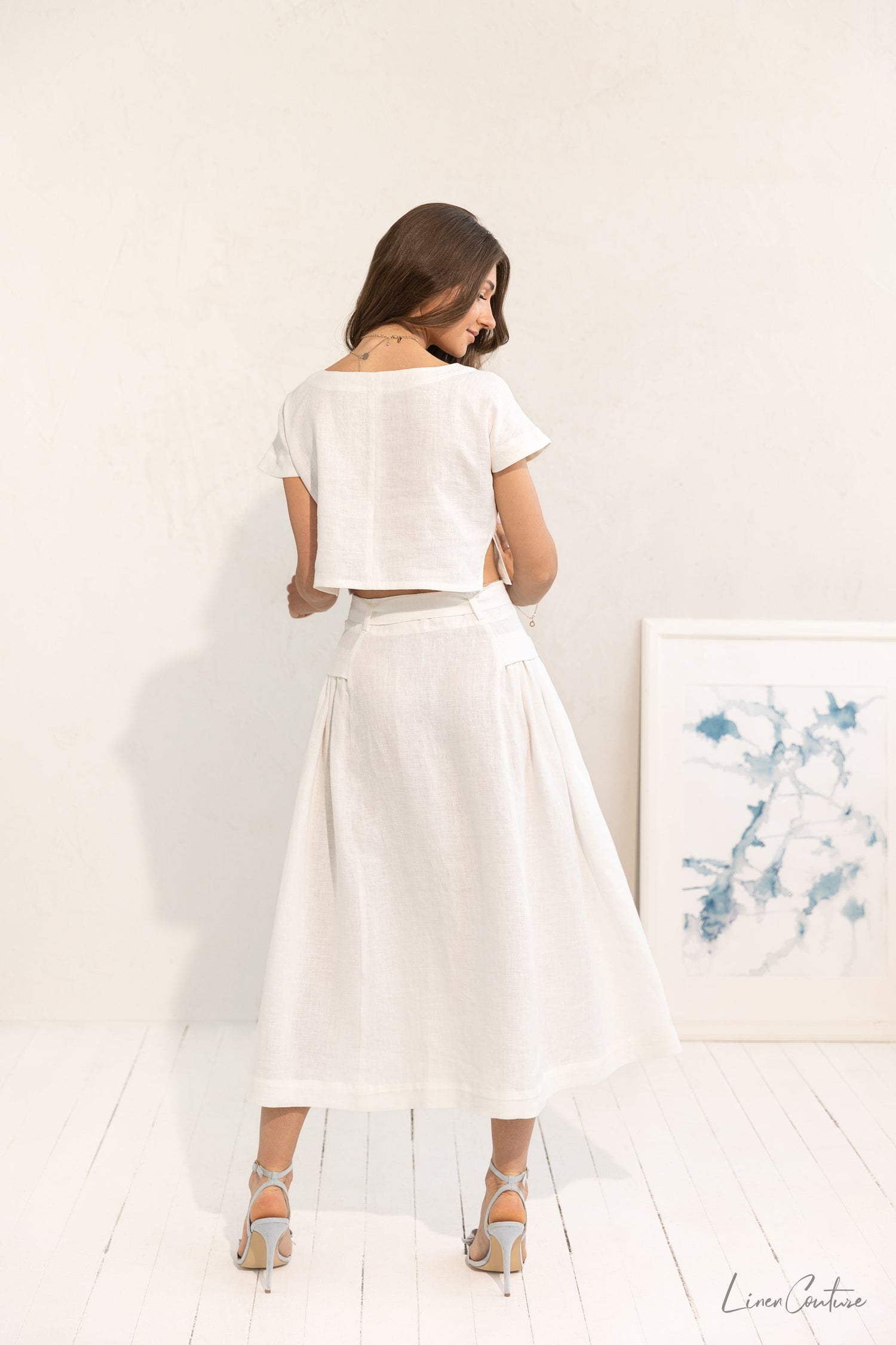 Magenta Sugarplum Taormina linen crop top and flared midi skirt matching set, light fabric, stylish and comfortable ensemble.
