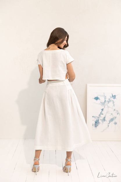 Magenta Sugarplum Taormina linen crop top and flared midi skirt matching set, light fabric, stylish and comfortable ensemble.