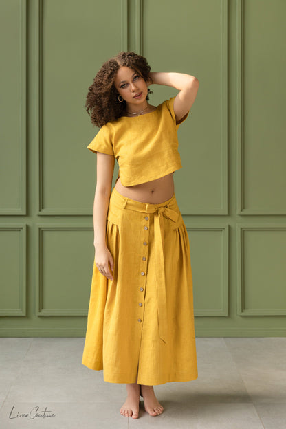 Magenta Sugarplum Taormina linen crop top and flared midi skirt matching set displayed on a model