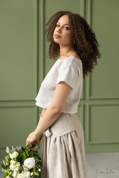 Magenta Sugarplum Taormina Set with linen crop top and flared midi skirt, displayed on a model in a stylish, casual look.