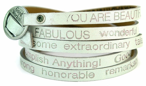 Silver wrap-around bracelet by Orange Eunostus titled "Peaceful" featuring intricate designs and a stylish, elegant finish.