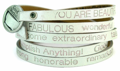 Silver wrap-around bracelet by Orange Eunostus titled "Peaceful" featuring intricate designs and a stylish, elegant finish.