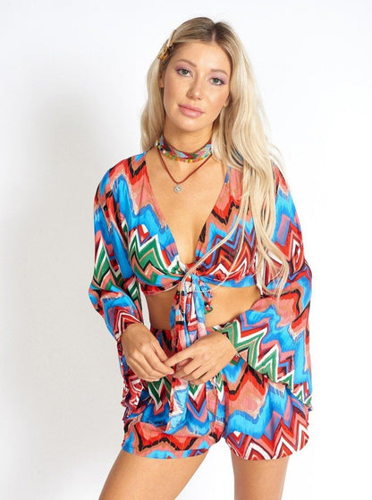 Rainbow Waves Bohemian front tying crop top for women by Azure Thanatos, featuring vibrant rainbow wave pattern and relaxed fit.