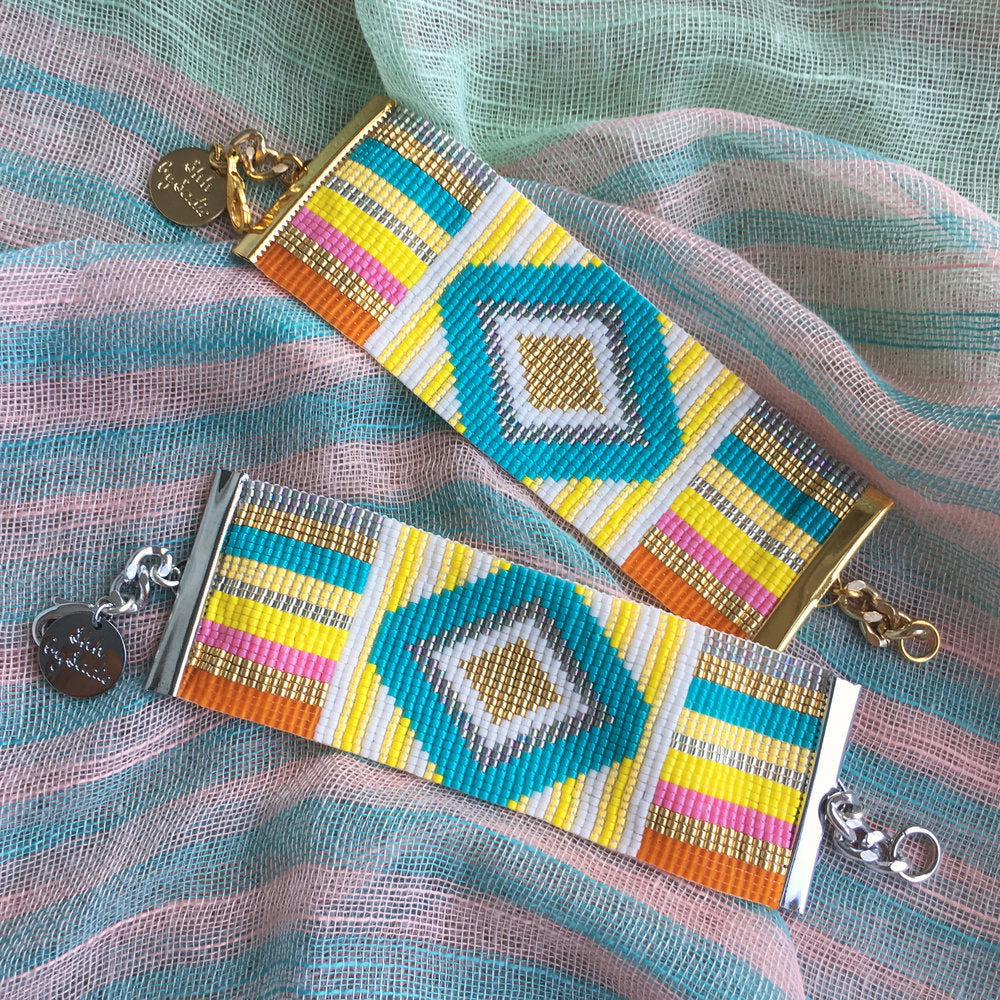 Yellow Athena rainbow bracelet with colorful cuff design, featuring vibrant rainbow-colored beads and a stylish bracelet style.